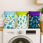 Drie airenso wet bags met dino-, cactus- en ruimteprint