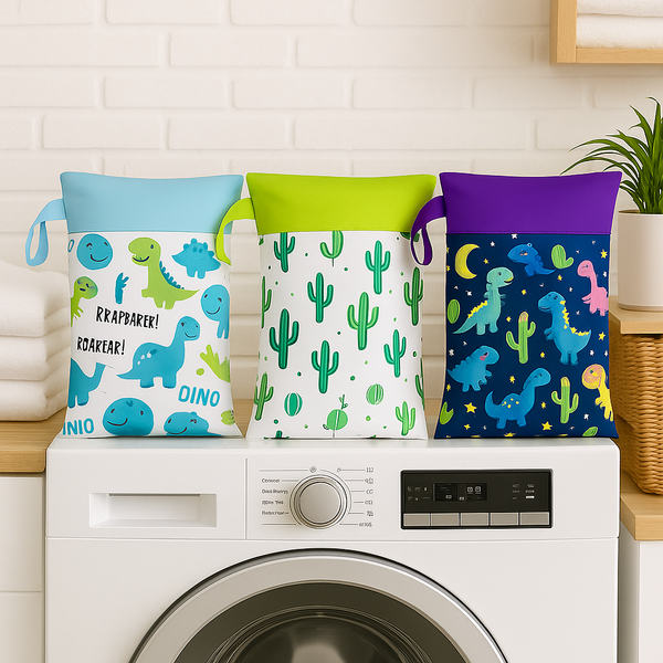 Drie airenso wet bags met dino-, cactus- en ruimteprint