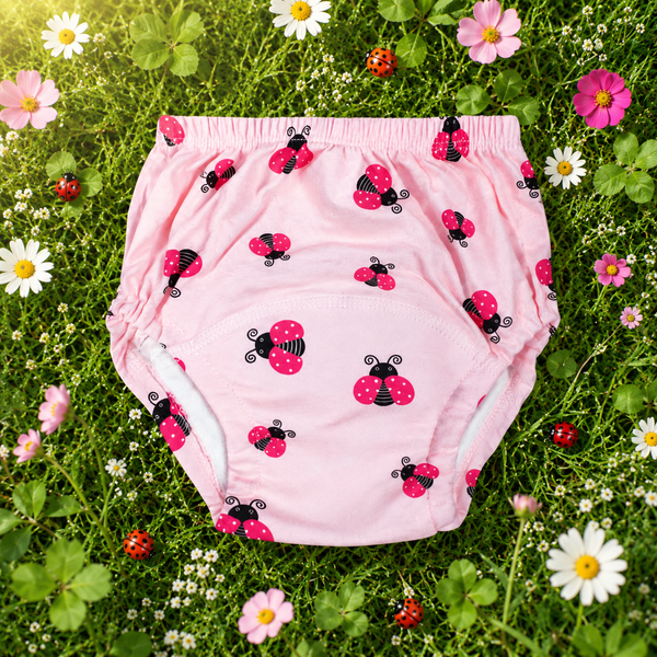 airenso trainingsbroekje roze met lieveheersbeestjes tussen gras en bloemen